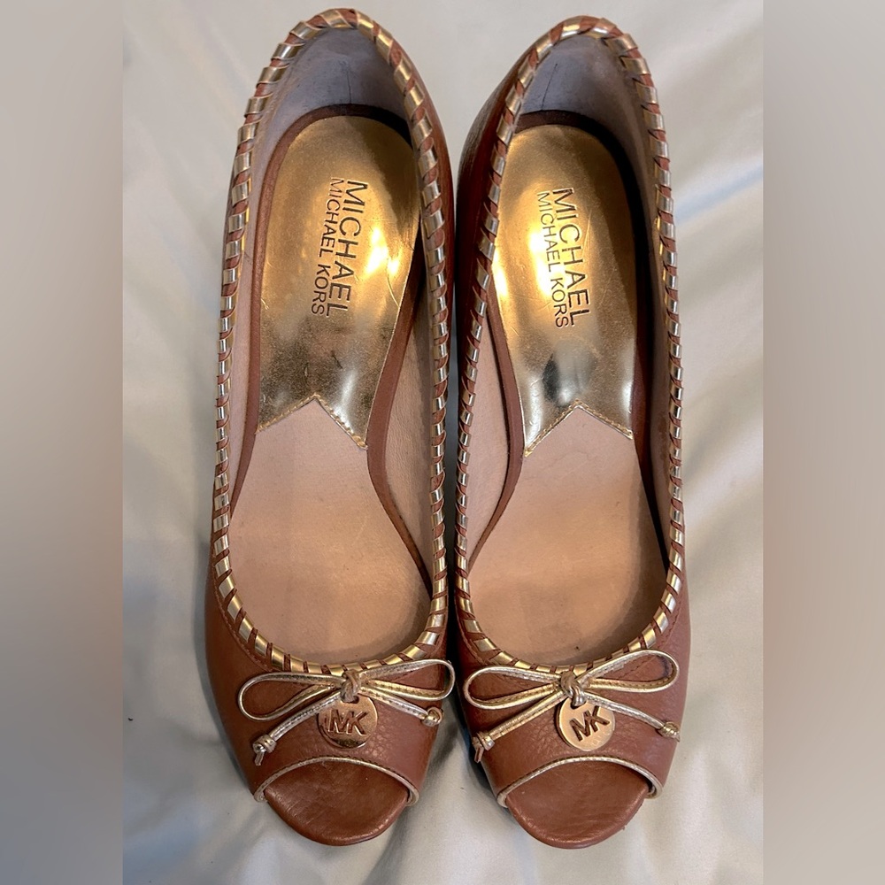 Platform size 9 heels, monogram accents Micheal Kors.